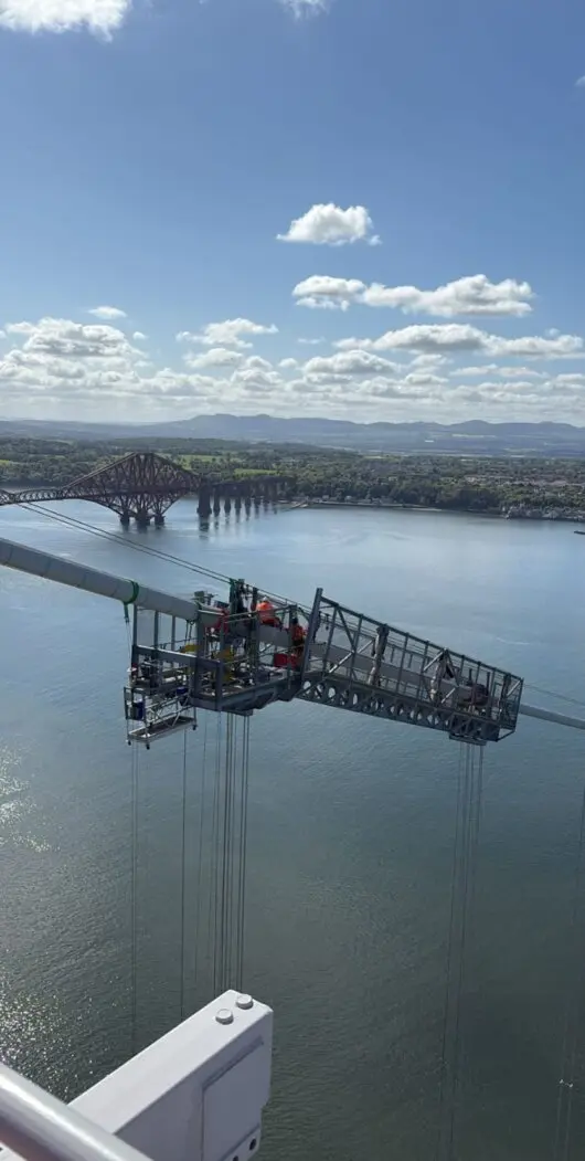 Rope access technicians cleaning a high-rise building facade